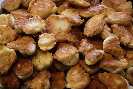 Fresh fried crispy fritter muffins. Many pancakes delicious background.の写真素材