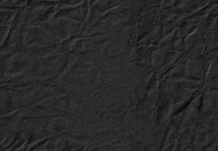 Seamless black battered craft paper texture. Recycling beige page. Vertical portrait orientation.の写真素材