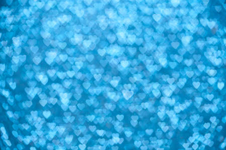 Valentine's Day Concept: Blue Sparklng Defocused Romantic Background of Lights Hearts..の写真素材