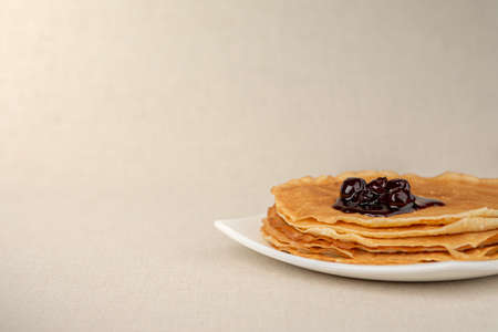 pancakes at the plate with cherry jamの写真素材