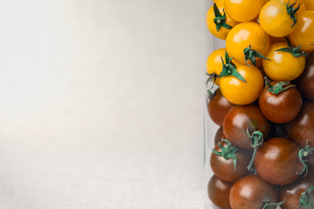 Cherry tomatoes at the linen background coloredの写真素材