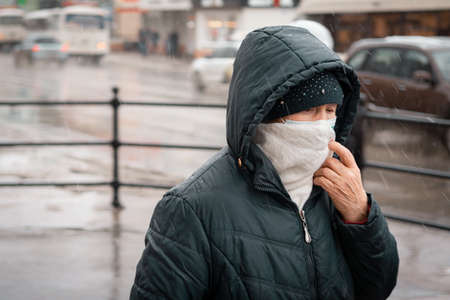 26 October 2020, Tomsk, Russia: woman in mask on streetのeditorial素材
