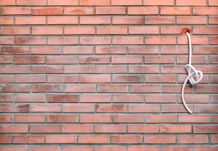 sticking out wire from the brick wall