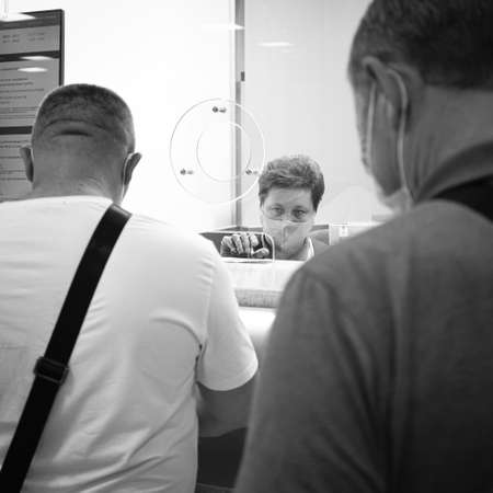 14th of August, Moscow, Russia, cashier in ticket office in mask