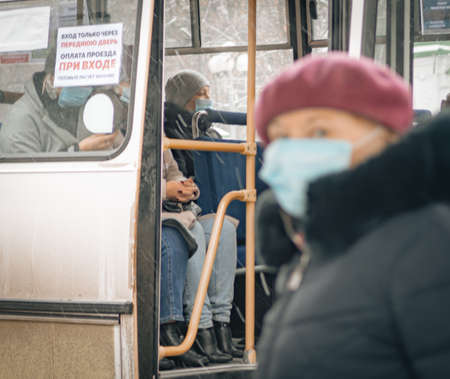 26th of October 2020, Russia, Tomsk, passengers in city transport in medical masksのeditorial素材