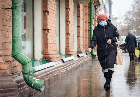 26th of October 2020, Russia, Tomsk, woman with medical mask on streetのeditorial素材