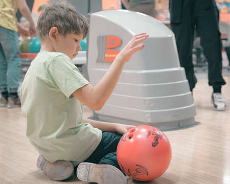 22nd of January 2022, Russia, Tomsk, children play bowlingのeditorial素材