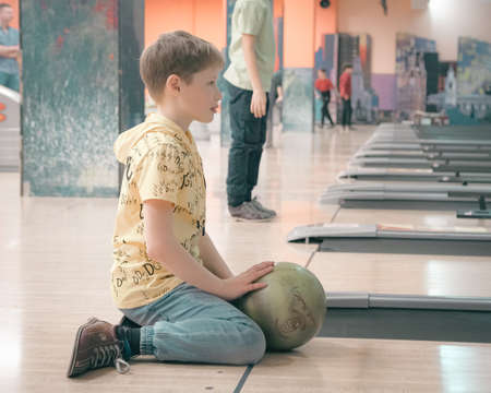 22nd of January 2022, Russia, Tomsk, children play bowlingのeditorial素材