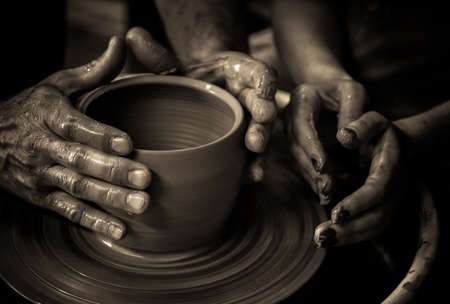 working on potter's wheel fragmentary portrait monochromeの写真素材