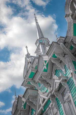 30th of May 2022, Russia, Tomsk, Wooden historical building in Tomsk on the sky backgroundのeditorial素材