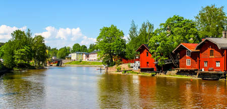Old red warehouses alongside river Porvooの写真素材