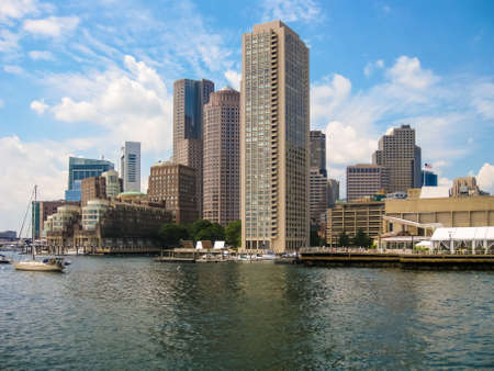 Boston harbor skyline on a beautiful summer day from the oceanの写真素材