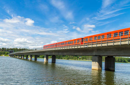 HELSINKI, FINLAND - 27. June, 2015. Helsinki metro train crossing the  Vuosaari bridgeのeditorial素材