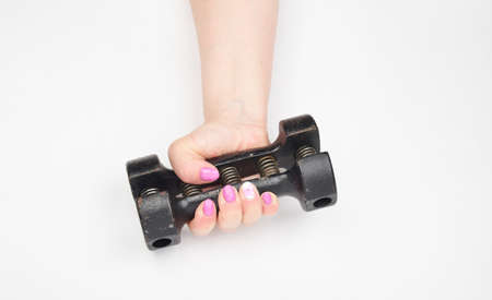 female hand and black iron expanderの写真素材