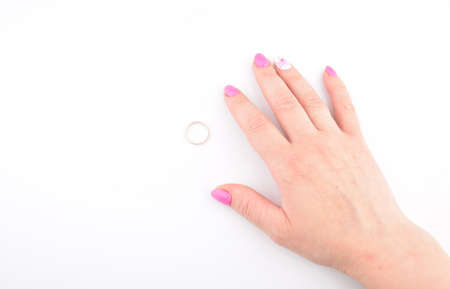 wedding ring and female hand on white backgroundの写真素材