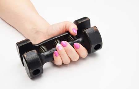 female hand and black iron expanderの写真素材