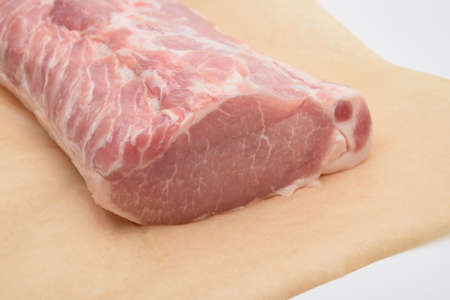 pork carbonate on parchment on white backgroundの写真素材