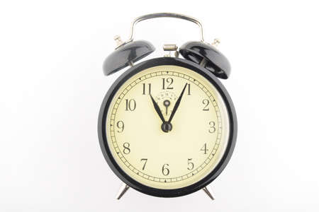 black and white alarm clock on white backgroundの写真素材