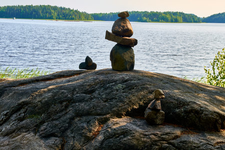 figurines made of small stones on the shore of the lake. High quality photoの写真素材
