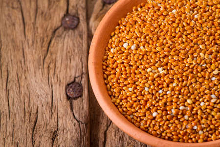 red millet seeds on wooden background, super foodの写真素材
