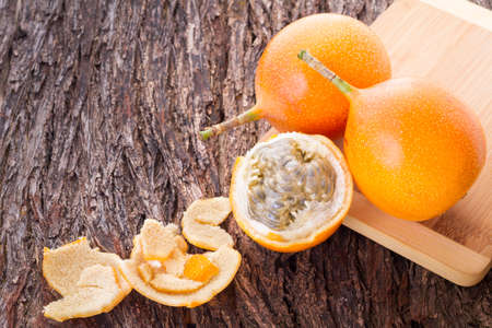 Passion fruit granadilla on the table - Passiflora ligularisの写真素材