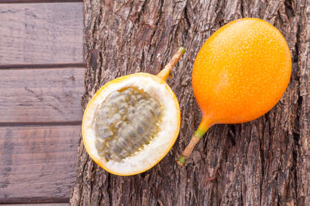 Passion fruit granadilla on the table - Passiflora ligularisの写真素材