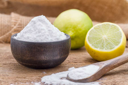 lemon and baking soda on the tableの写真素材