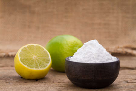 lemon and baking soda on the tableの写真素材