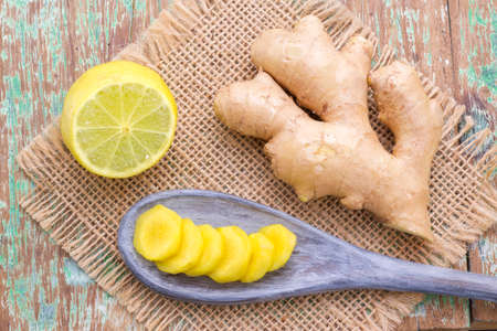 ginger and lemon on the table seen from aboveの写真素材