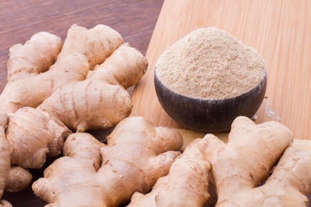 Roots and ginger powder on the table, top viewの写真素材