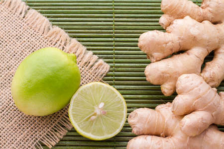 ginger and lemon on the table seen from aboveの写真素材