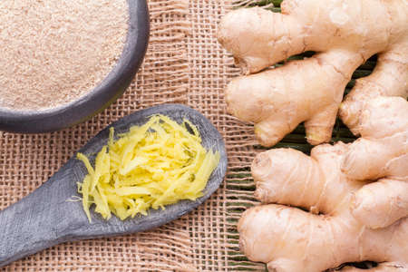 Roots and ginger powder on the table, top viewの写真素材