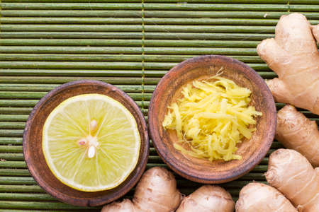 ginger and lemon on the table seen from aboveの写真素材