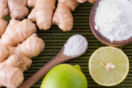 lemon and baking soda on the tableの写真素材