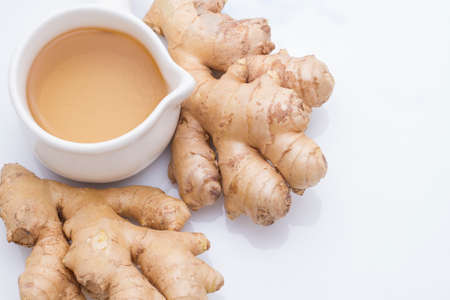 refreshing ginger tea on white backgroundの写真素材