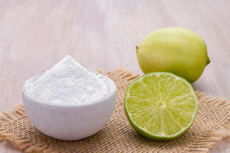 lemon and baking soda on the tableの写真素材