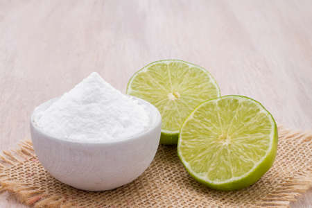 lemon and baking soda on the tableの写真素材