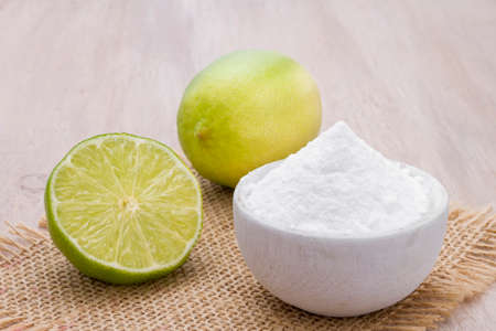 lemon and baking soda on the tableの写真素材