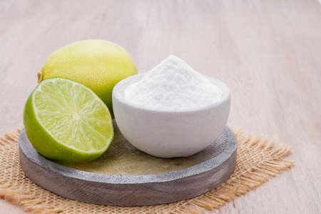 lemon and baking soda on the tableの写真素材
