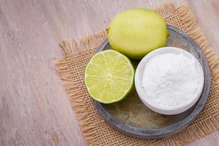 lemon and baking soda on the tableの写真素材