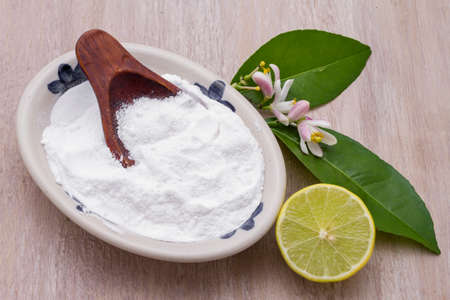 lemon and baking soda on the tableの写真素材