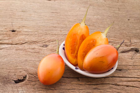 tree tomato fruits on the table (Solanum betaceum)の写真素材