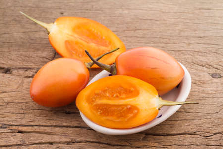 tree tomato fruits on the table (Solanum betaceum)の写真素材