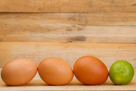 chicken and lemon egg on wood.の写真素材