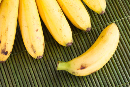 banana fruit on the wooden table (Musa Ã paradisiaca).の写真素材