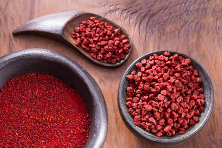 achiote in bowl on wooden background, achiote pasteの写真素材