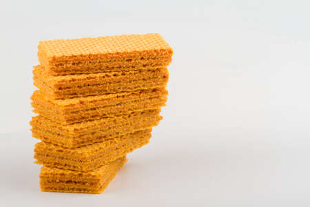 wafer biscuits stacked on white backgroundの写真素材