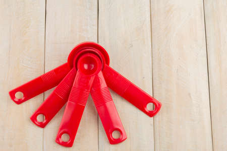 set of measuring spoons on wooden background