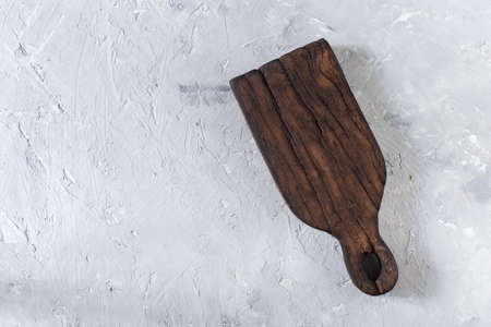 old chopping board viewed from above on white background.の写真素材