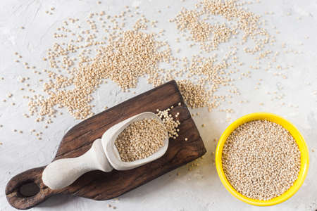 organic quinua cereal in color bowl on white backgroundの写真素材